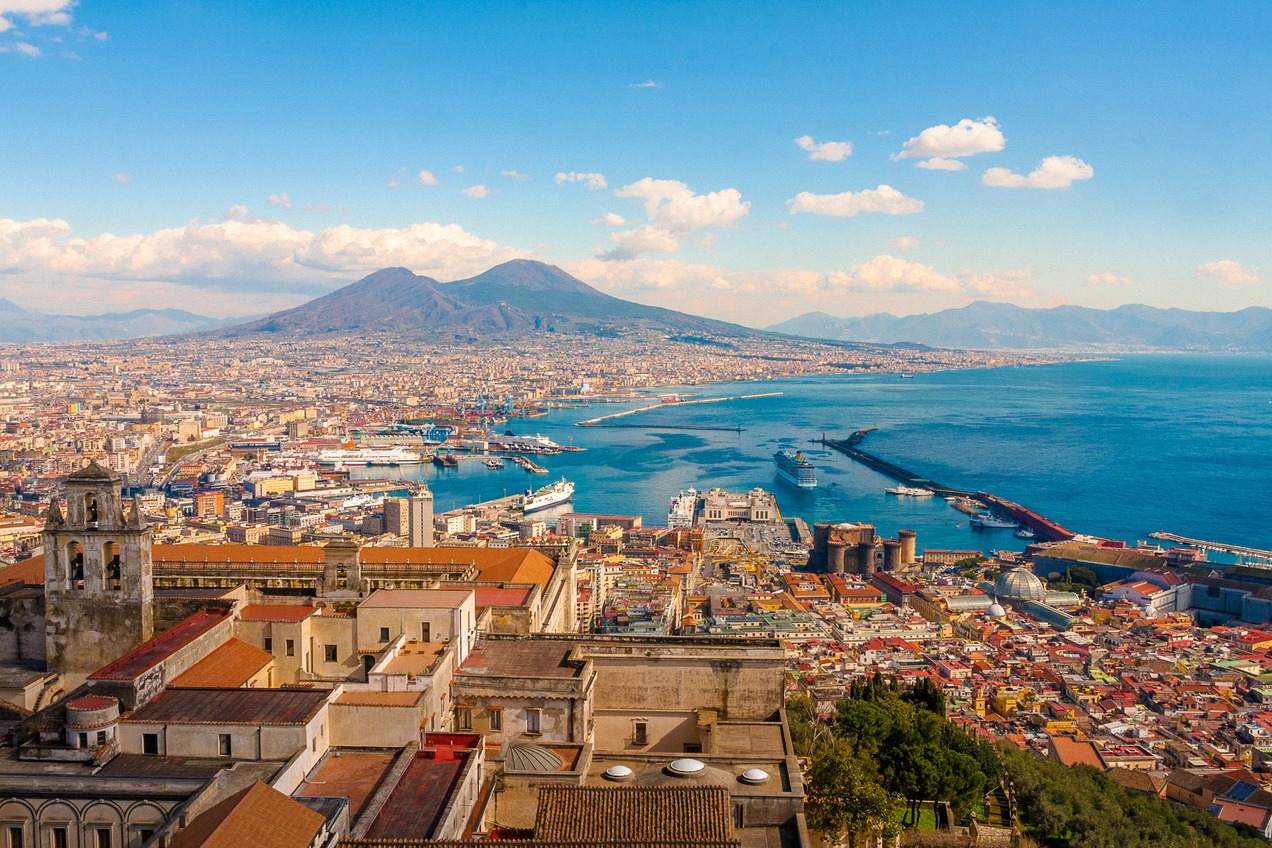Panorama of Naples with the port, ferries and cruise ships and Vesuvius in the background